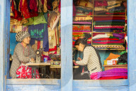 Young nepalese women working in an open Tailor shop in Bandipur, Tanahun district, Nepal
