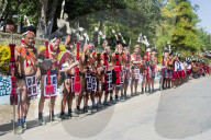 Naga tribal group performers standing in line to welcome the Officials at the Hornbill Festival, Kohima, Nagaland, India