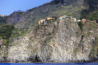 Colourful houses and cliffs atop rocky promontory, Corniglia, Cinque Terre, UNESCO World Heritage Site, Ligurian Riviera, Liguria, Italy, Europe