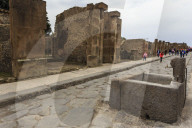 Public fountain on cobbled street, Roman ruins of Pompeii, UNESCO World Heritage Site, Campania, Italy, Europe