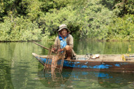 Crayfish fisherman on a tributary of the Phipot River in the Cardamom mountains