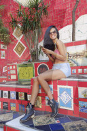 Young Brazilian woman 20-29 years old using her mobile phone on the Selaron steps in Lapa, Central Rio de Janeiro