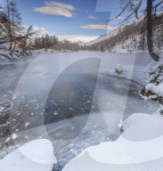 Panorama of frozen Lago Azzurro at dawn, Spluga Valley, Province of Sondrio, Valtellina, Lombardy, Italy, Europe