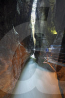 Water of creek flows in the narrow limestone gorge carved by river, Aare Gorge, Bernese Oberland, Canton of Uri, Switzerland, Europe