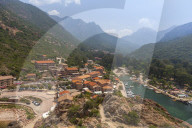 The typical village and harbor of Porto immersed in the green vegetation of the promontory Southern Corsica France Europe