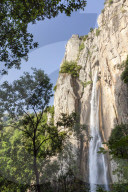 The Piscia di Gallo waterfall surrounded by granite rocks and green woods Zonza Southern Corsica France Europe