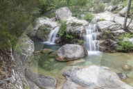 View of the Purcaraccia waterfalls and natural pools in summer Punta di Malanda Bavella Mountains Quenza Corsica France Europe