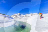Photographer at the Bernina Pass during the spring thaw, St Moritz, canton of GraubÃ¼nden, Upper Engadine, Switzerland, Europe