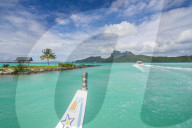 Little boat in the turquoise lagoon of Bora Bora, French Polynesia