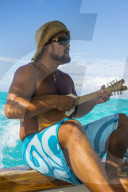 Local man playing the Ukulele, Bora Bora, French Polynesia