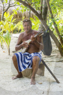 Local man playing the Ukulele, Bora Bora, French Polynesia