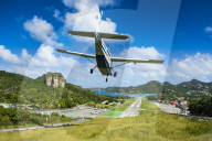 Small airplane landing in the airport of St Barth or Saint Barthelemy, Greater Antilles