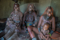 Friendly Himba women in thei hut, Kaokoland, Namibia