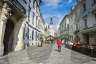 Pedestrian zone in the center of Bratislava with MichaelÂ´s gate in the background, Slovakia