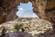 Local guide sitting in one the Laas Geel caves, Somaliland, Somalia