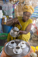 Woman serving ethiopian coffee, Danakil depression, Ethiopia