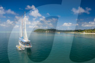 Sailing boat anchoring on Mana island, Mamanuca islands, Fiji