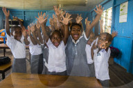 Very happy school children in a school, Yanuya island, Mamanuca islands, Fiji, South Pacific, Pacific