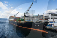 Cargo ship anchoring in the harbour of Ushuaia, Tierra del Fuego, Argentina, South America
