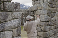 Restoration work at the Inca ruins of Macchu Picchu, Peru