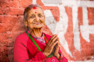 Old woman praying at Pashupati Temple