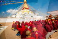 Buddhist Monks praying around temple at Bouddha