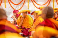 Buddhist Monks praying around temple at Bouddha