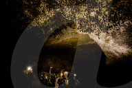 Cavers shining lamps on bats in Pokhara Bat Caves