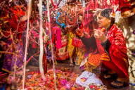 Woman praying at the Holi Festival Durbar Square