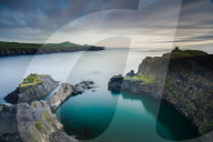 Looking along the Pembrokeshire coast headland above the Abereiddy Blue Lagoon, a former slate quarry.