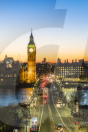 Big Ben, the Elizabeth Tower, and busy traffic on Westminster Bridge at dusk, London, England