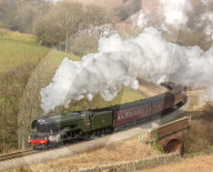 The Flying Scotsman steam locomotive arriving at Goathland station on the North Yorkshire Moors Railway.
