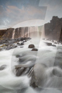 Ã–xarÃ¡rfoss waterfall at sunrise in Thingvellir National Park, Iceland.