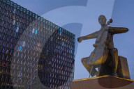 Statue of Danish cellist Erling BlÃ¶ndal Bengtsson, by sculptor Ã“lÃ¶f PÃ¡lsdÃ³ttir, and the Harpa Concert Hall, Reykjavik, Iceland