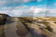 A paved cycling path along the Dutch coast