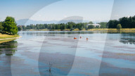 Kayaks at Idroscalo in Milan, which is a large park just outside the city centre on a summer's day, with alps visible