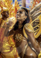 Brazil, State of Rio de Janeiro, City of Rio de Janeiro, Samba Dancer in the Carnival Parade.