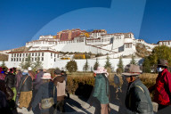 The Potala Palace with Tibetan Buddhist devotees, Lhasa Tibet
