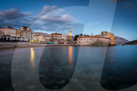 A long exposure during the evening blue hour of the beach and stari grad (old town) of Budva, Montenegro.