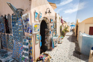 Souvenir shops selling pictures, magents and jewellery in Oia, Santorini
