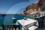 A table with a view at one of the seafood restaurants in Ammoudi Bay (Amoudi) which sits at the bottom of some steps below Oia.