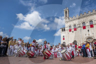 Italy, Umbria, Gubbio, Band in Signoria Square (Piazza Grande) during Ceri Festival