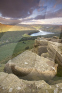 Ladybower reservoir from the gritstone escarpment of Bamford Edge at sunrise in spring, Bamford, Peak District, Derbyshire, UK