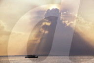 Dramatic cloud formations and boat in silhoutte at sunset, Dhuni Kolhu, Baa Atoll, Republic of Maldives, Indian Ocean