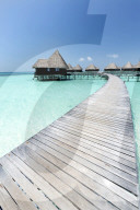 Over-water villas, crystal clear sea and blue sky, Coco Palm, Dhuni Kolhu, Baa Atoll, Republic of Maldives, Indian Ocean