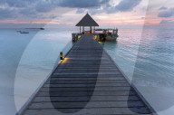Wooden jetty and boat at sunset, Coco Palm resort, Dhuni Kolhu, Baa Atoll, Republic of Maldives, Indian Ocean