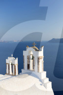 White church belltowers overlooking the Caldera, Oia, Santorini, Cyclades, Greece