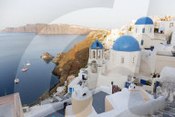 Classic view of the village of Oia with its blue domed churches and colourful houses, Oia, Santorini, Cyclades, Greece