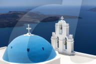 Blue dome and belltower of the church of St Gerasimos, Firostefani, Fira, Santorini, Cyclades, Greece