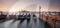 View towards San Giorgio Maggiore at dawn from Riva Degli Schiavoni, with gondolas in foreground, Venice, Italy